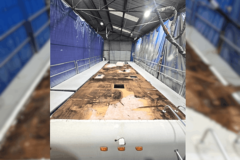 RV roof problems, RV repair in LaPlace, LA by RV Masters. Image of a recreational vehicle inside a professional repair bay with the damaged roof decking exposed, highlighting expert RV roof replacement, structural repairs, and long-term weather protection.