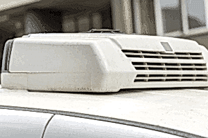 RV air conditioning repair, RV repair in LaPlace, LA, at RV Masters. An image of a rooftop RV air conditioning unit mounted on a recreational vehicle, illustrating the exterior A/C system used to keep campers cool and comfortable during travel and camping.
