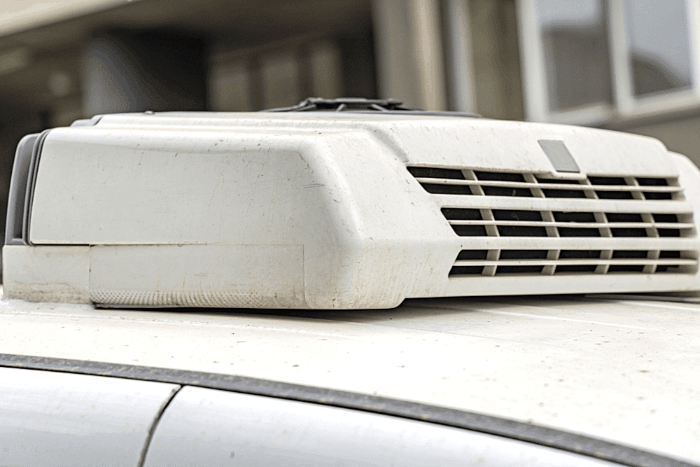 RV air conditioning repair, RV repair in LaPlace, LA, at RV Masters. An image of a rooftop RV air conditioning unit mounted on a recreational vehicle, illustrating the exterior A/C system used to keep campers cool and comfortable during travel and camping.